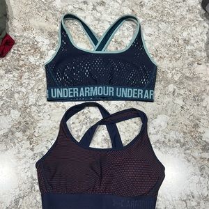 2 Underarmour sports bras. One is padded and one is not.